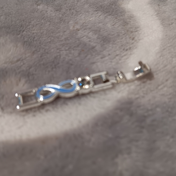 Blue enamel and crystal infinity bracelet. - Picture 10 of 14